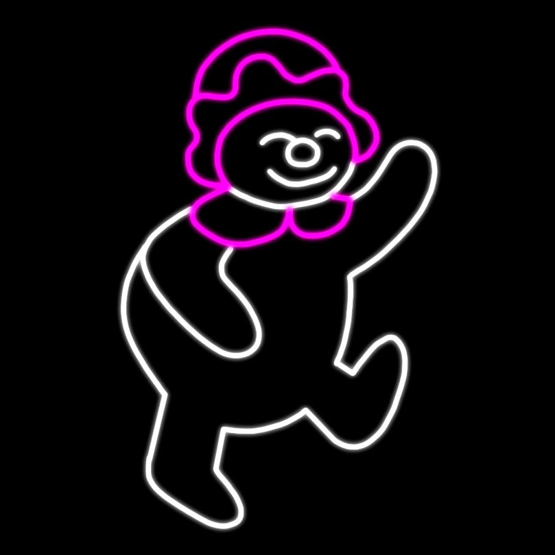 A silhouette LED display of a playful snow-girl wearing a pink hat and scarf, outlined with bright white and pink LED lights, set against a black background.