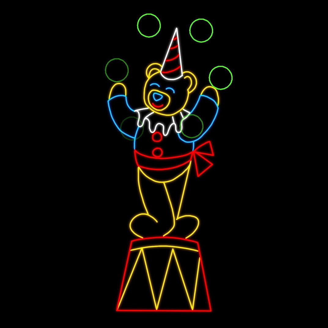 A colorful Teddy Bear with Red Bow Juggling Balls LED silhouette display featuring a playful bear dressed in a clown outfit with a red and white striped party hat, standing on a drum. The bear is juggling five bright green balls, and its cheerful appearance is emphasized by vibrant colors including white, yellow, blue, green, and red LED lights, creating a captivating visual effect against a black background.