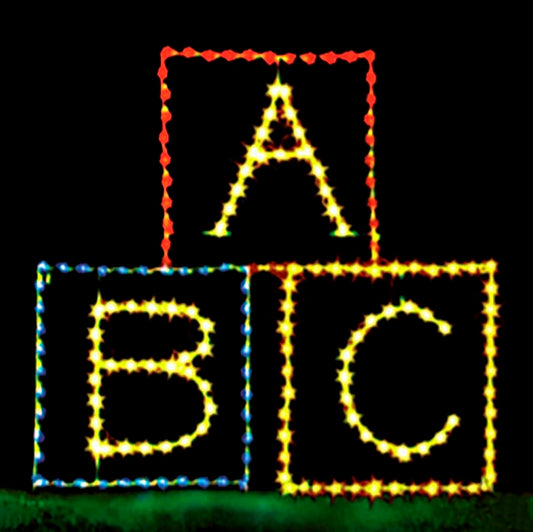 ABC Blocks Nostalgic Toys Silhouette LED Display featuring three brightly lit blocks with the letters A, B, and C. The display is illuminated with vibrant red, blue, and yellow LED lights, creating a playful and nostalgic scene against a black background. This charming and whimsical display is perfect for commercial Christmas decorations, ideal for businesses, theme parks, and event venues looking to enhance their holiday displays