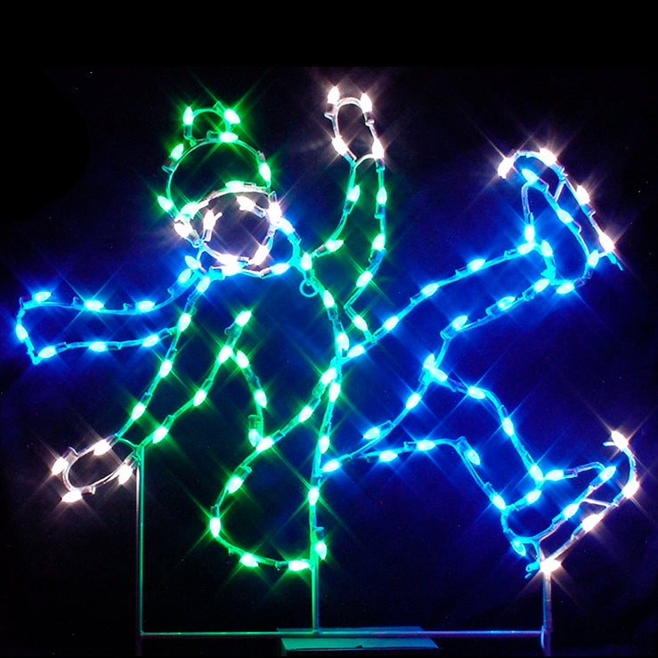 A silhouette LED display of a boy falling on ice, outlined with bright white, green, and blue LED lights, set against a dark background.