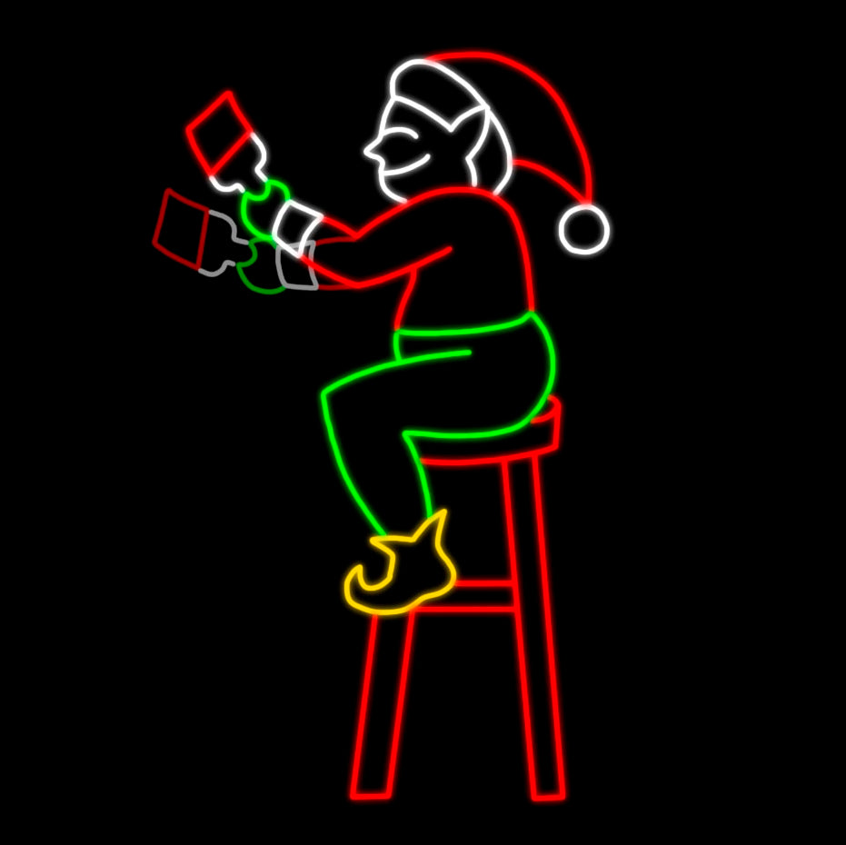 Christmas Elf Painting Silhouette LED Display featuring an animated scene of a cheerful elf perched on a stool, busily painting. The display is illuminated with bright red, green, white, and yellow LED lights, creating a dynamic and festive scene against a black background.