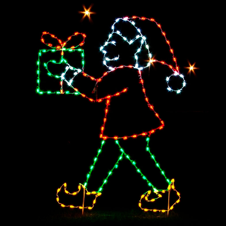 Christmas Elf Walking Silhouette LED Display featuring a cheerful elf carrying a wrapped gift. The display is illuminated with bright red, green, and white LED lights, highlighting elf hat, clothing, and the gift box. Set against a black background, the vibrant lights create a festive and joyful ambiance, making this display ideal for theme parks, parades, and event venues looking to enhance their holiday events.