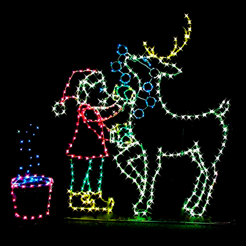 Christmas Elf Washing Cute Reindeer Silhouette LED Display featuring an animated scene of an elf washing a reindeer. The display is illuminated with bright red, green, blue, and yellow LED lights. The elf is shown standing beside the reindeer with a bucket of water, creating a playful and festive scene against a black background. This vibrant and dynamic display is ideal for businesses, theme parks, municipalities, and event venues looking to enhance their holiday displays.