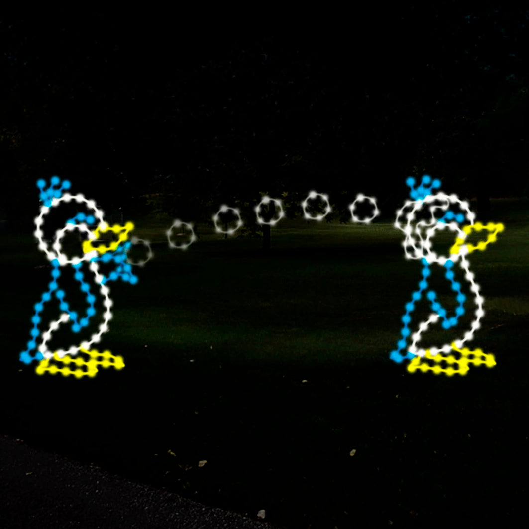 A cute penguin LED outdoor display featuring two penguins tossing snowballs at each other. The penguins are outlined in yellow, white, and blue LED lights, creating a playful and animated scene against a dark background.