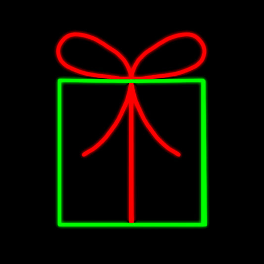 Perfect Gift with Red Bow Silhouette LED Display featuring a beautifully wrapped present with vibrant green and red LED lights. The display includes a large red gift bow, making it an ideal festive decoration for commercial Christmas settings such as businesses, theme parks, municipalities, and any large or small event venues.