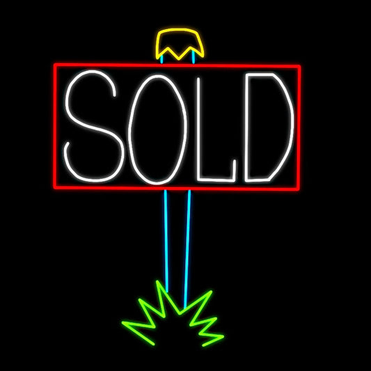 A bright LED silhouette display of a large "SOLD" sign. The sign is outlined in red with the word "SOLD" illuminated in white. The signpost is shown with blue lines leading to a green burst at the bottom, symbolizing it being firmly placed into the ground. The vibrant display stands out against a black background, making the message clear and eye-catching.