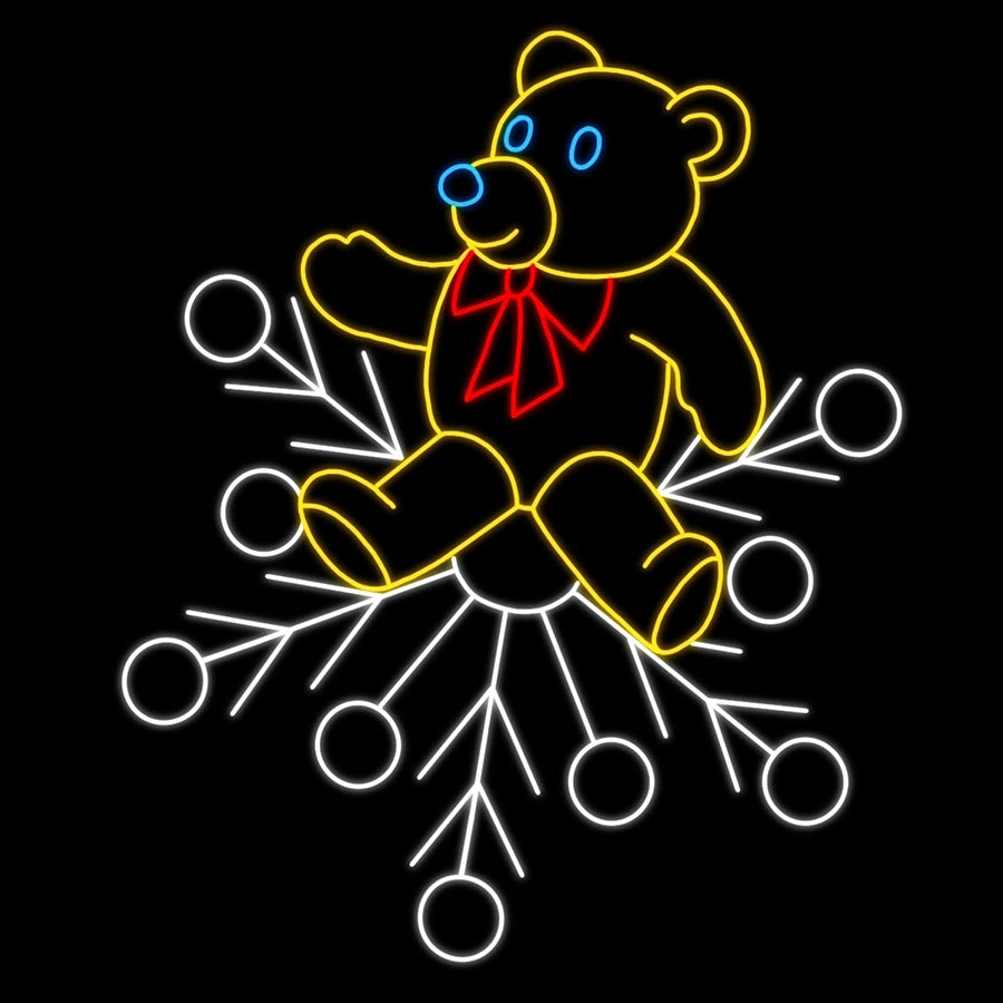 Teddy Bear with Red Bow on Snowflake Silhouette LED Display featuring a cute teddy bear with a red bow tie sitting atop a winter snowflake outline with yellow, red, white, and blue LED lights. Perfect for businesses, theme parks, municipalities, and other large and small event venues looking for whimsical Christmas decorations.